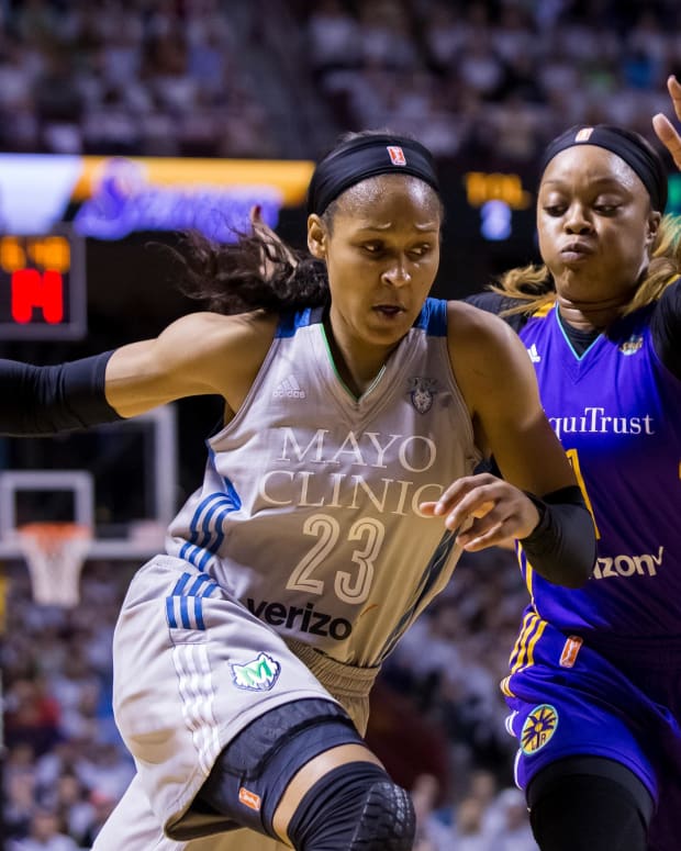 Oct 4, 2017; Minneapolis, MN, USA; Minnesota Lynx forward Maya Moore (23) dribbles in the first quarter against the Los Angeles Sparks guard Odyssey Sims (1) in Game 5 of the WNBA Finals at Williams Arena.